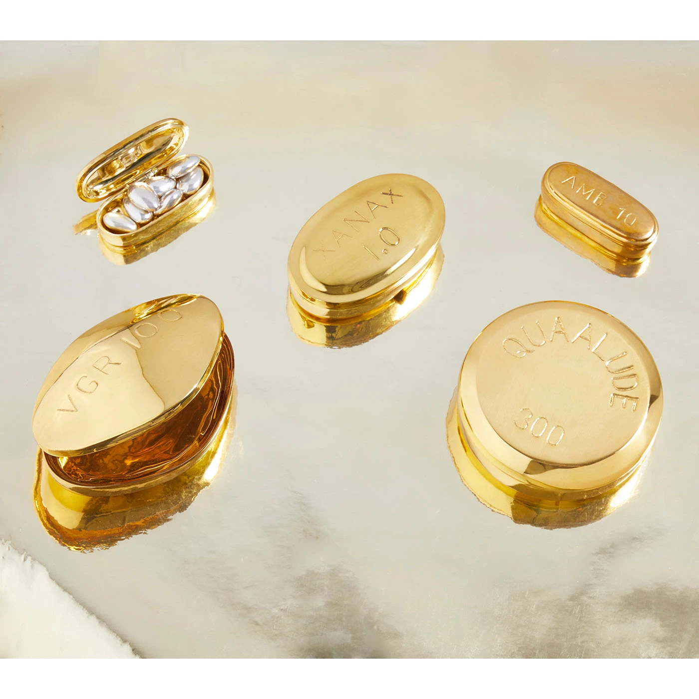 brass_pill_boxes_01ceb8cc-bb4f-4994-9bc9-2fd88df8f8de.jpg Jonathan Adler Xanax Pill Box