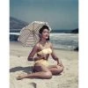 Jonathan Adler "Woman On Beach Holding Umbrella" From Getty Images