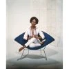 Jonathan Adler "Young Woman Sitting On Armchair" From Getty Images Photography